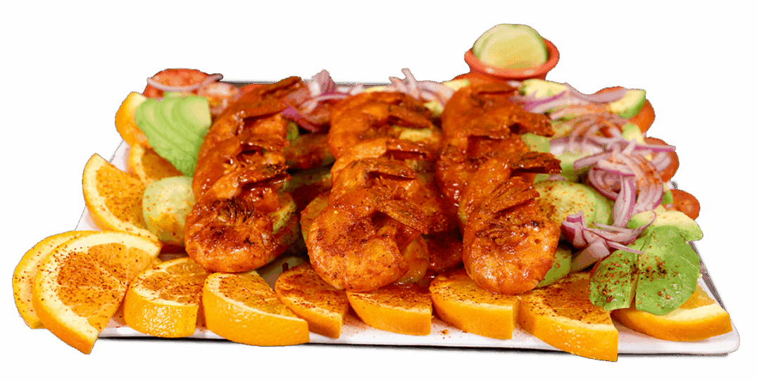 sauted shrimps with spicy fruits Plate of saulted shrimps with fruit and salad